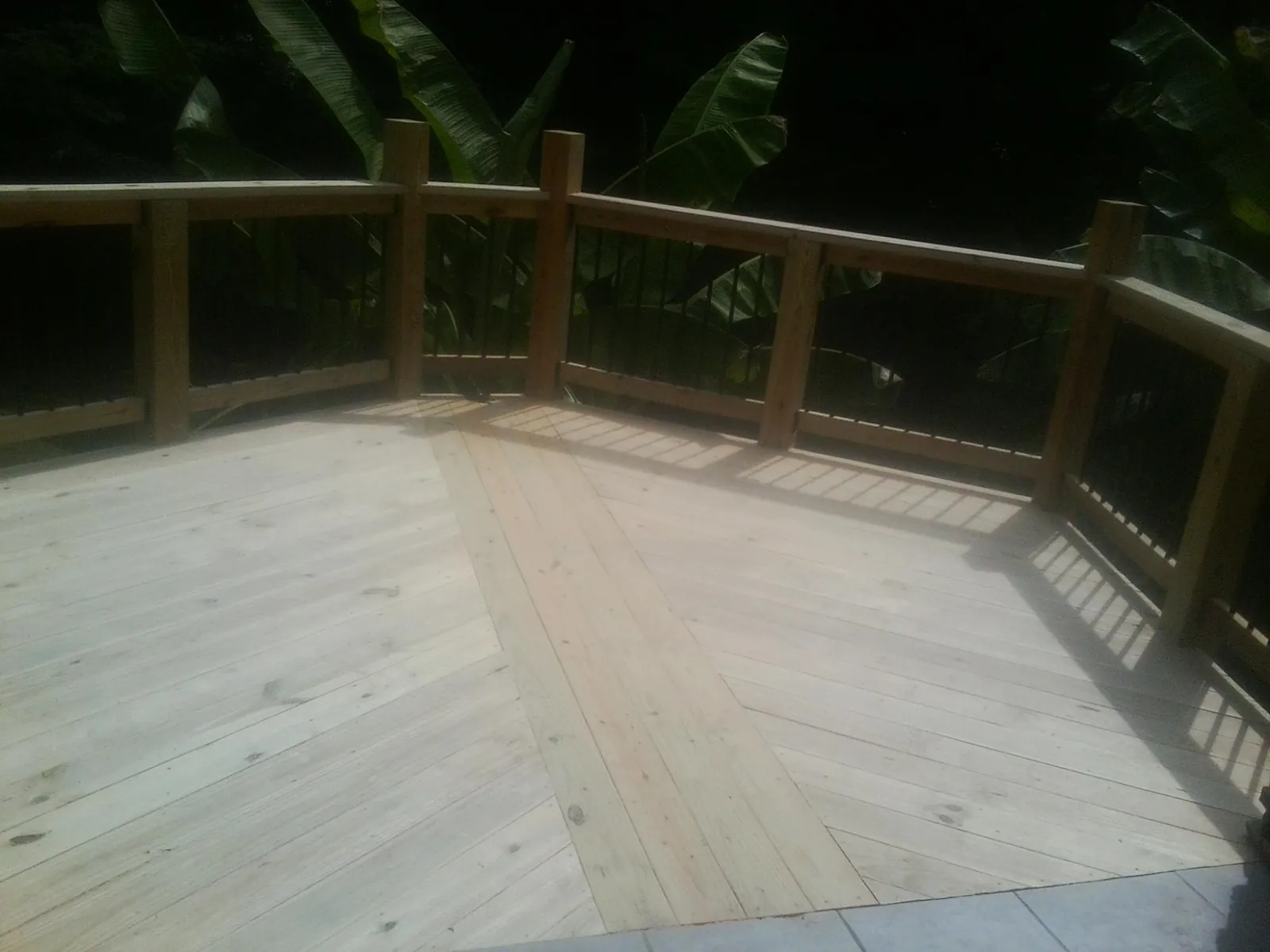 New wood deck and railing built off the back of a home in Gowrie